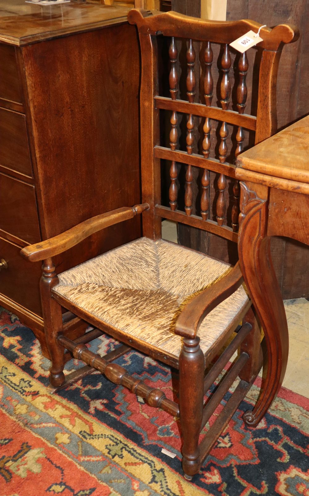 A 19th century Lancashire spindleback rocking chair with rush seat